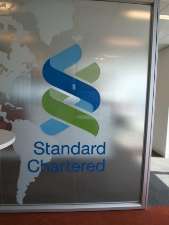 A sign that says standard chartered