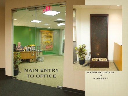 A water fountain in the entrance of an office.
